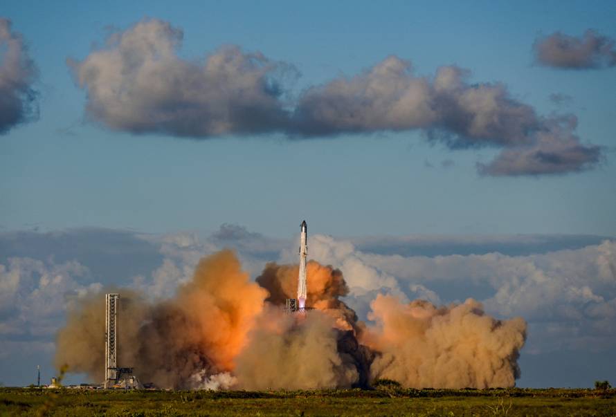 A SpaceX Super Heavy booster carrying the Starship spacecraft lifts off on its 11th test flight