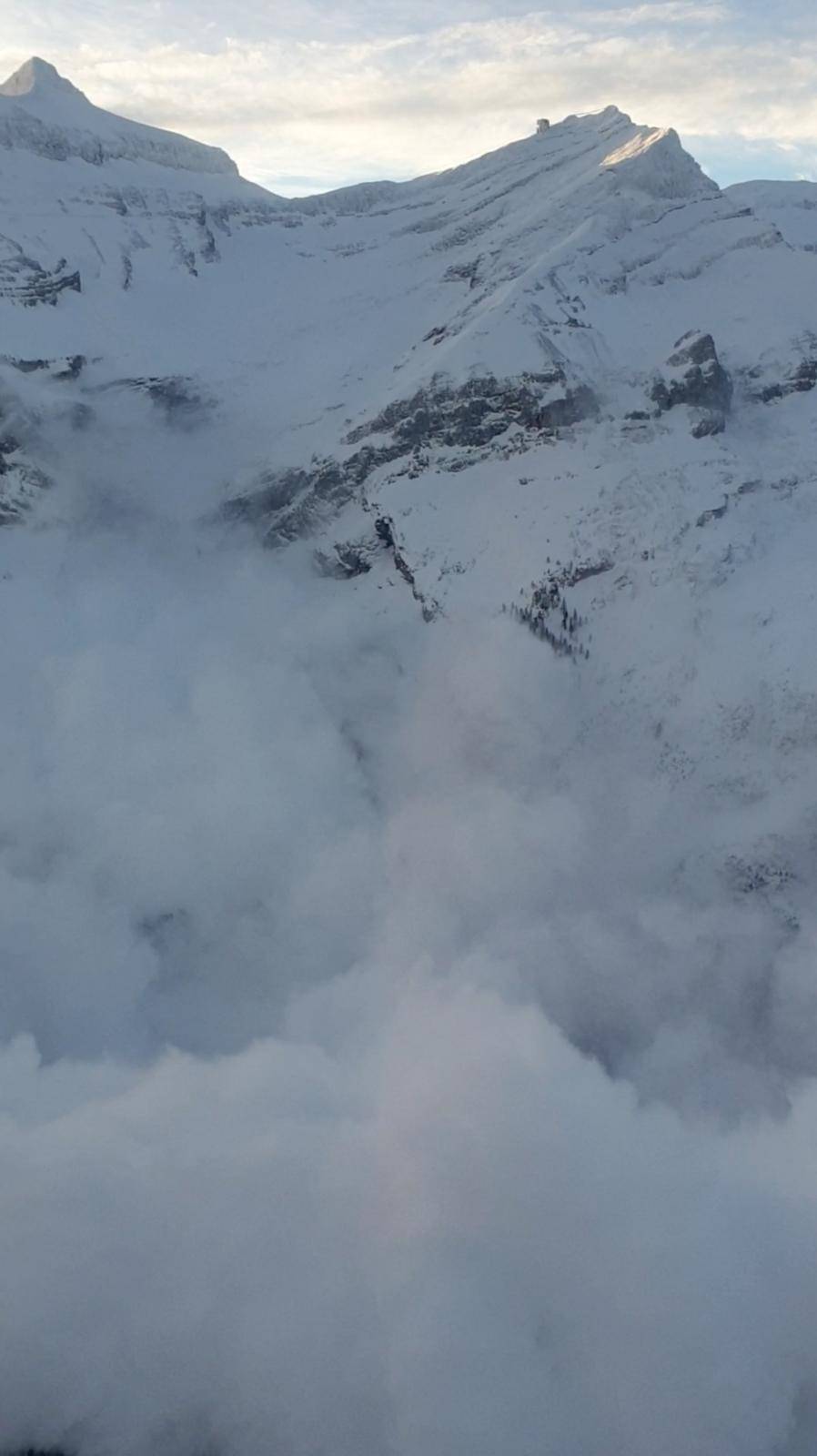 An avalanche after a controlled explosion is pictured at Glacier 3000 in Les Diablerets