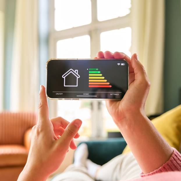 Close,Up,Of,Woman,Looking,At,Screen,Of,Energy,Efficiency