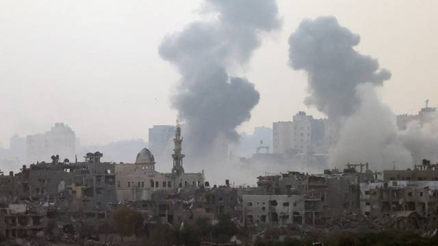 Smoke is rising after an Israeli strike on Gaza seen from a viewpoint in Southern Israel