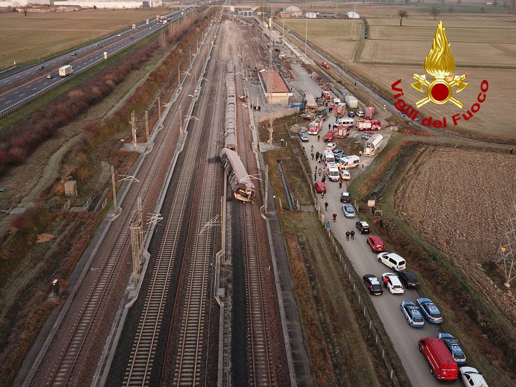 Emergency services are seen at scene after a high speed train travelling from Milan to Bologna derailed, in Lodi