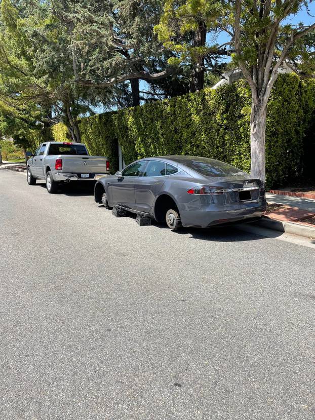 *PREMIUM-EXCLUSIVE* Owen Wilson's Tesla with Missing Tires in Photos