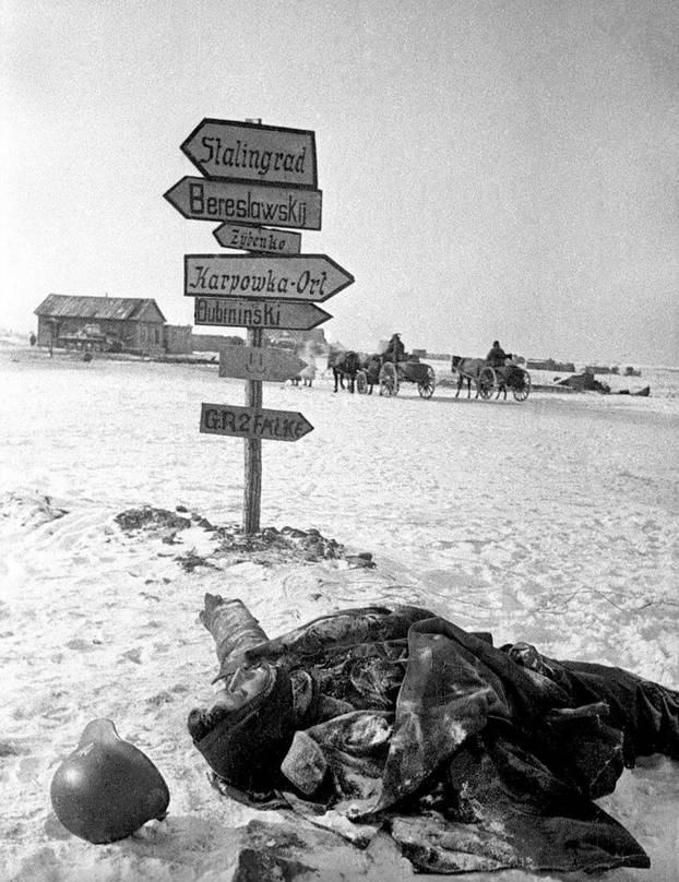 Russia / Germany: The frozen body of a German soldier lies where he fell, Stalingrad, February 1943