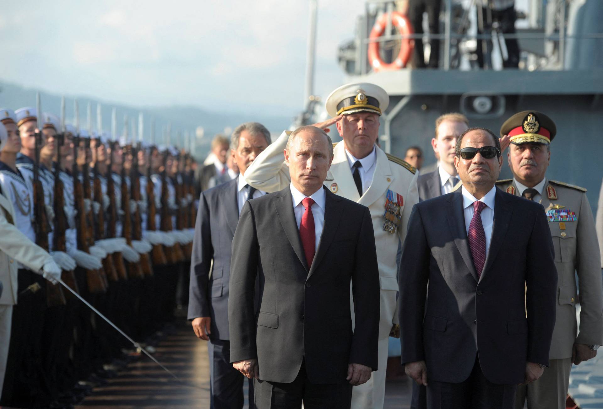 FILE PHOTO: Russia's President Putin, his Egyptian counterpart Sisi and Russia's Defence Minister Shoigu attend a welcoming ceremony onboard guided missile cruiser Moskva in Sochi