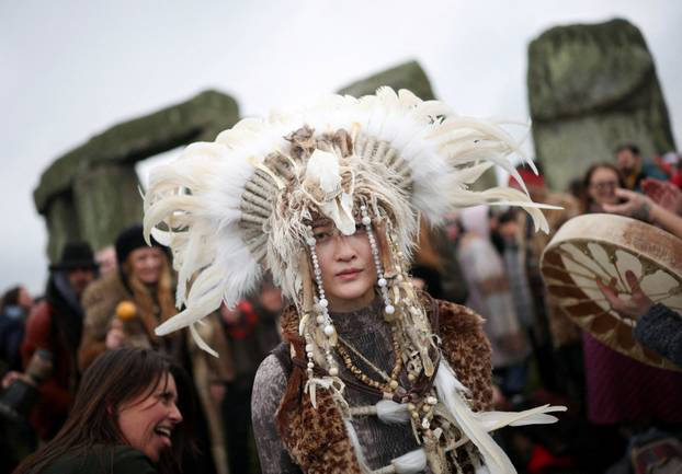 Winter solstice celebrations during sunrise at Stonehenge