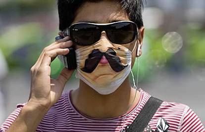 Protiv svinjske gripe nose se ukrasne zaštitne maske 
