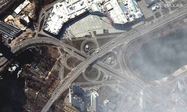 A satellite image shows people and cars trying to leave Kyiv