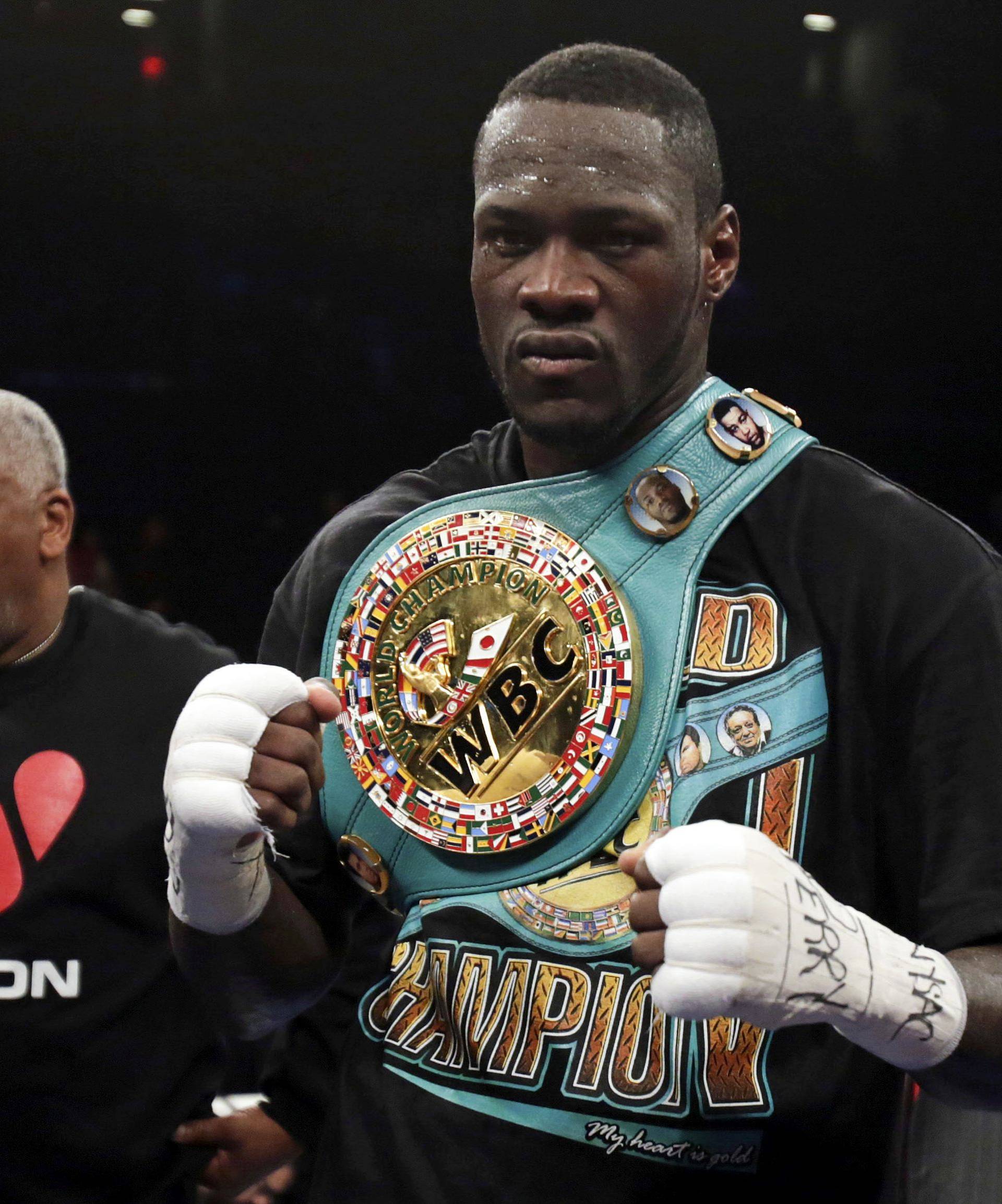 FILE PHOTO - Wilder celebrates after knocking out Artur Szpilka in the ninth round of their heavyweight title boxing fight at Barclays Center, in Brooklyn