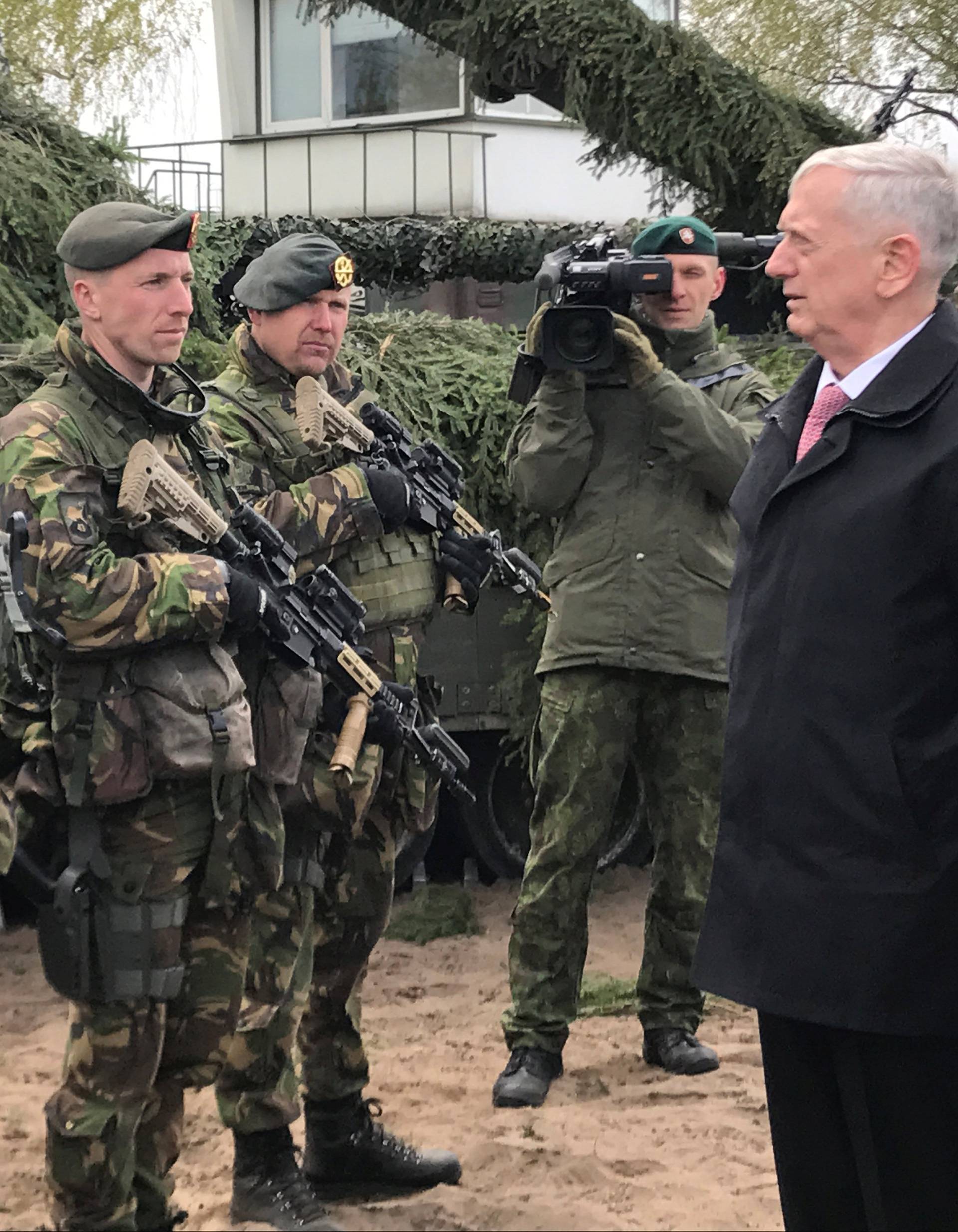 United States Defense Secretary Jim Mattis (R) tours Pabrade military training area in Lithuania