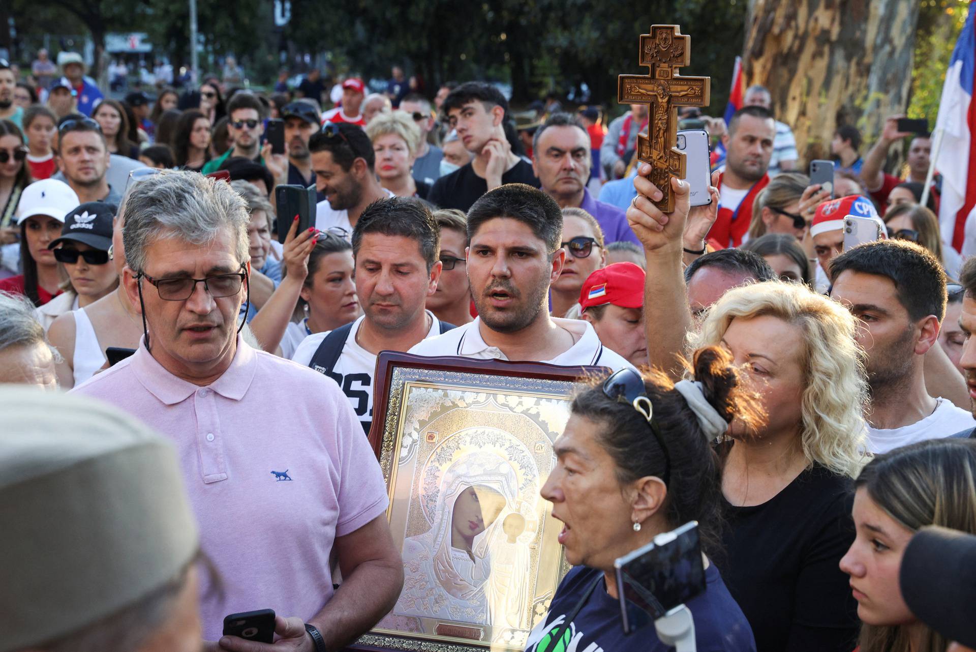 Supporters gather outside the hotel where Novak Djokovic is believed to be held in Melbourne