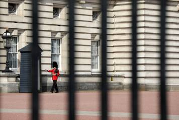 A guardsman is seen on duty in the grounds of Buckingham Palace in London