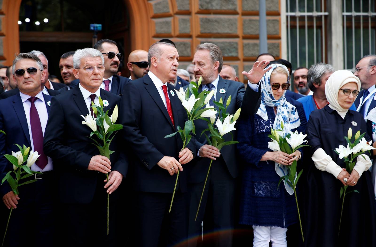 Members of Bosnian Presidency Zeljko Komsic and Sefik Dzaferovic, Turkey's President Recep Tayyip Erdogan with his wife Emine Erdogan and Bakir Izetbegovic pay their respects at a convoy carrying remains of the Srebrenica genocide victims, in Sarajevo