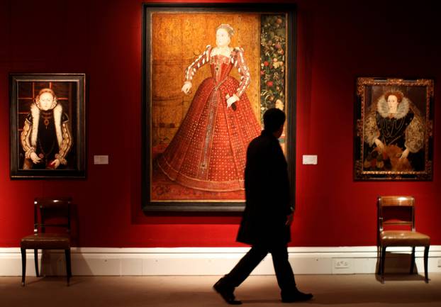 FILE PHOTO: File photo of person viewing portrait of Queen Elizabeth I by artist van der Meulen at Sotheby