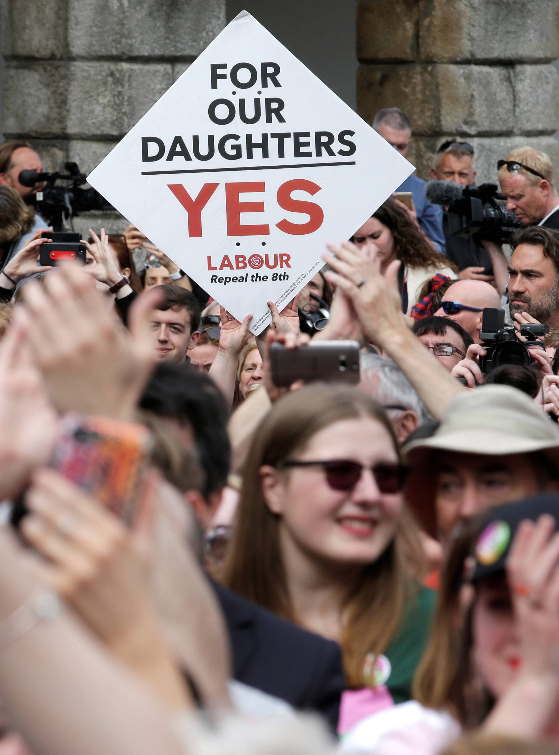 People celebrate the result of yesterday's referendum on liberalizing abortion law, in Dublin