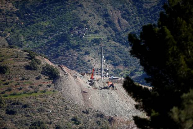 A crane removes steel tubes after failing to place them into the drilled well at the area where Julen, a Spanish two-year-old boy, fell into a deep well nine days ago when the family was taking a stroll through a private estate, in Totalan