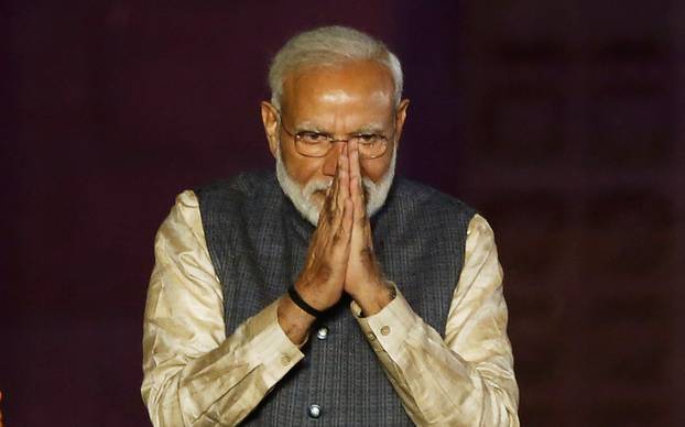 Indian Prime Minister Narendra Modi greets his supporters after the election results at Bharatiya Janata Party (BJP) headquarter in New Delhi