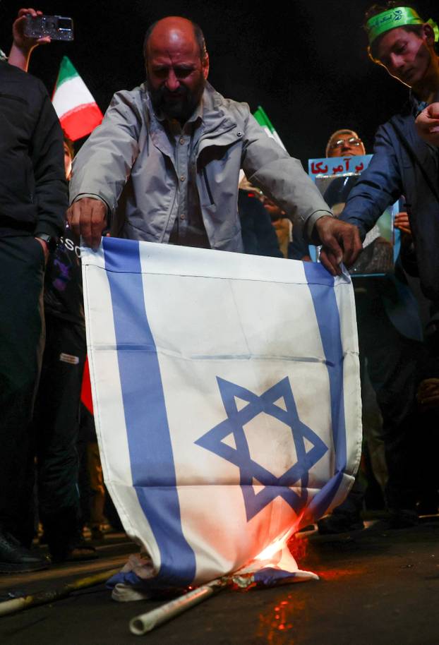People gather after a two-week ceasefire in the Iran war was announced, in Tehran