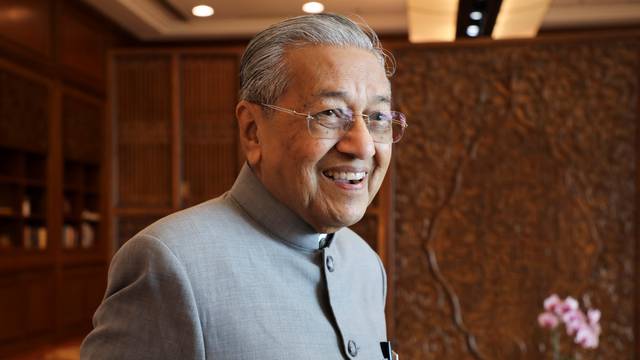 Malaysia's Prime Minister Mahathir Mohamad reacts during an interview with Reuters in Putrajaya