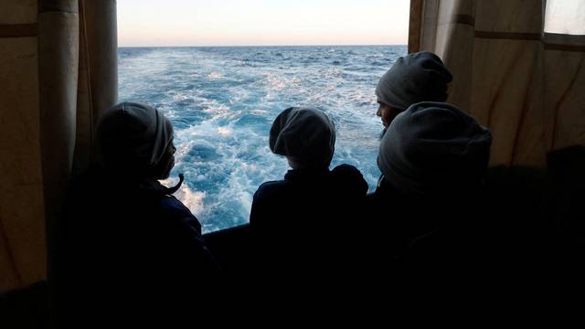 FILE PHOTO: Rescued migrants on MSF rescue ship Geo Barents in the Mediterranean