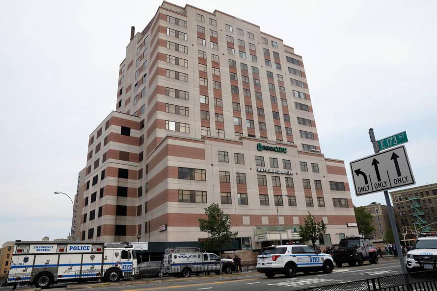 NYPD officers work outside Bronx-Lebanon Hospital, after an incident in which a gunman fired shots inside the hospital, in New York