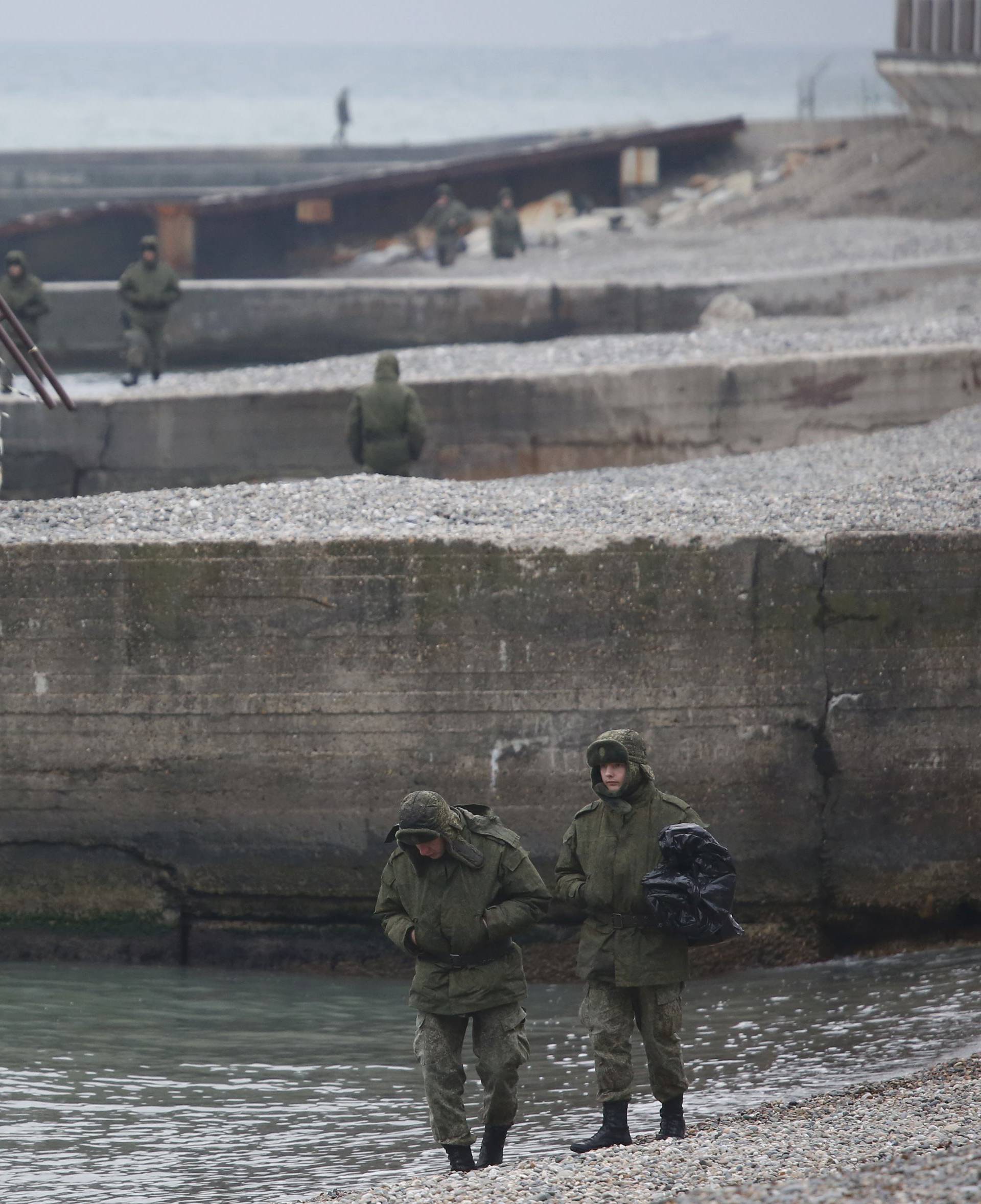 Russian servicemen stand at shores of Black Sea near crash site of Russian military Tu-154 plane, in Sochi suburb of Khosta