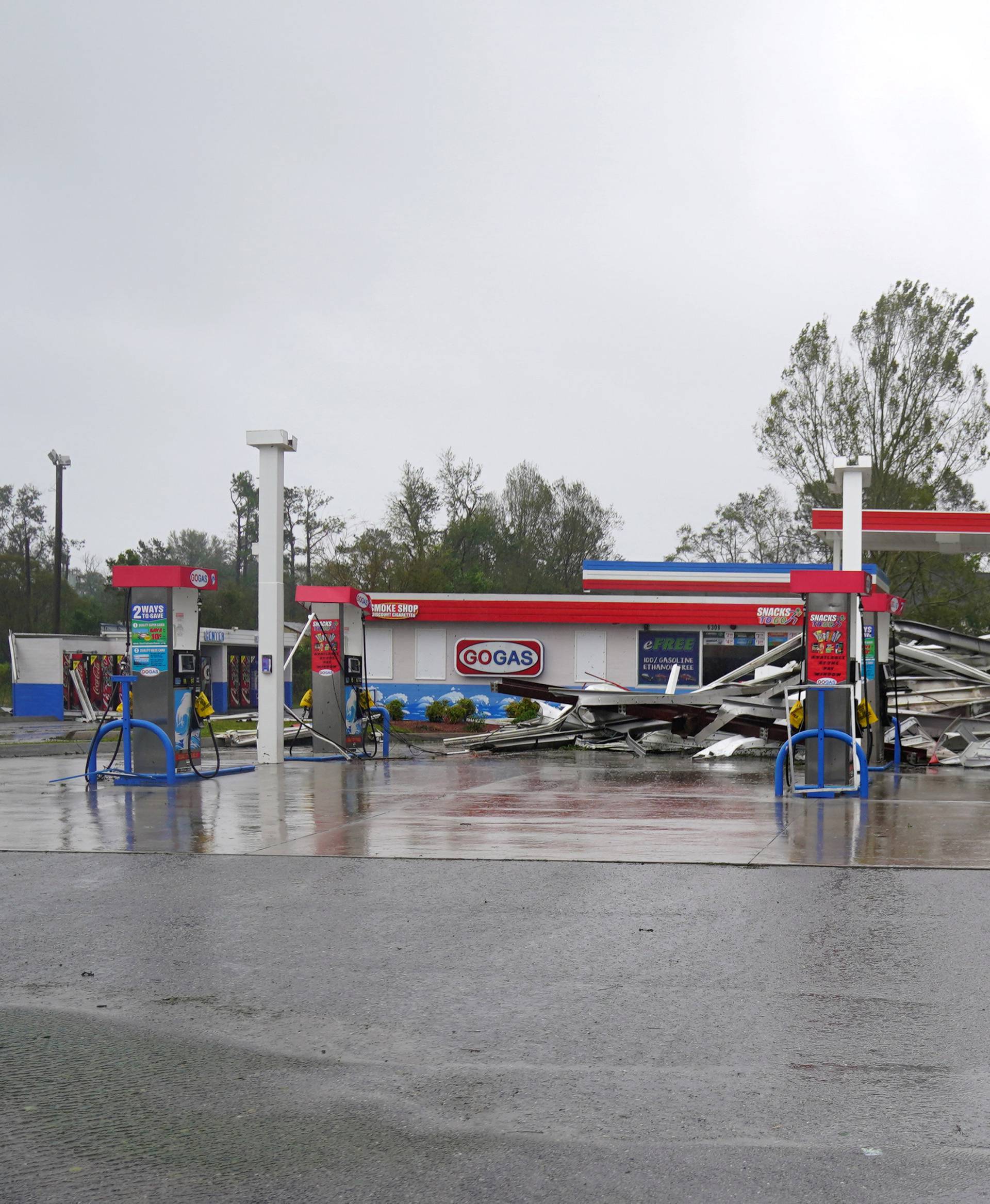 A gas station with its roof blown off is seen as Hurricane Florence comes ashore in Wilmington