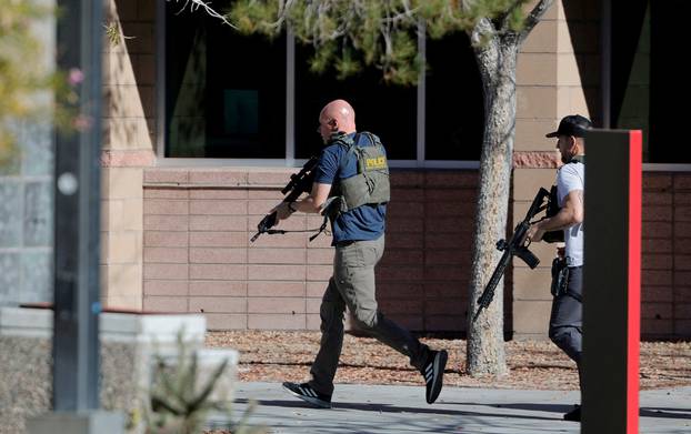 Law enforcement officers head into UNLV campus after reports of an active shooter in Las Vegas