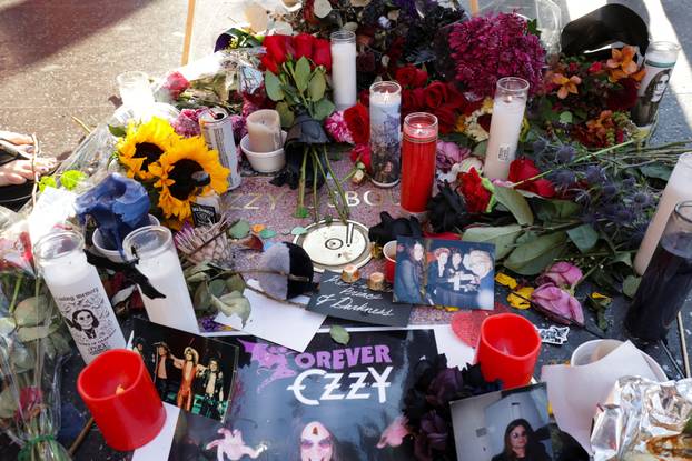 Flowers and pictures are placed on the star of late Ozzy Osbourne at the Hollywood Walk of Fame in Los Angeles