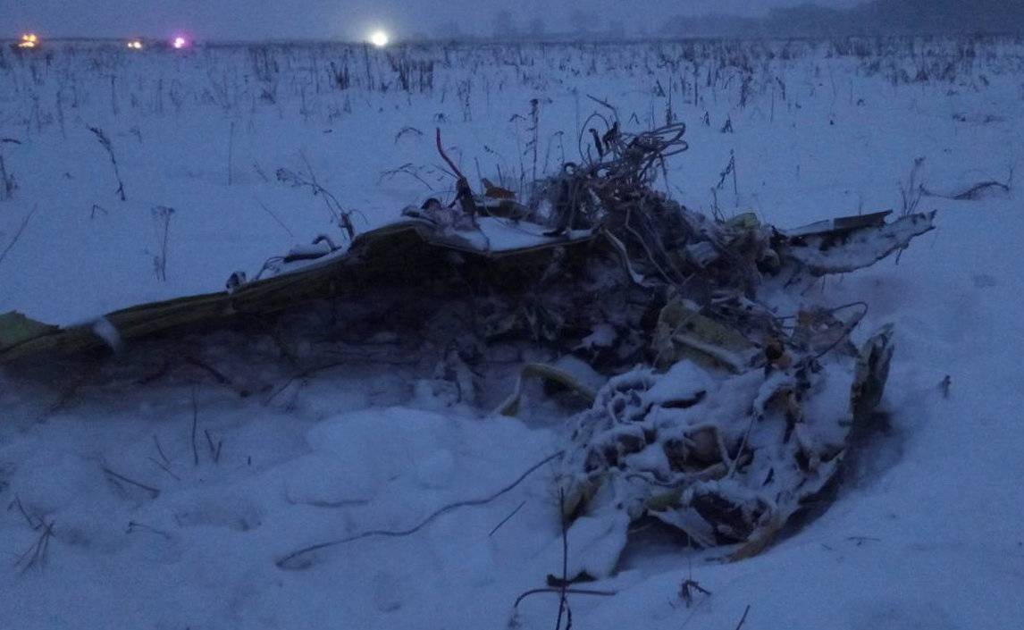 A part of a Saratov Airlines Antonov AN-148 plane that crashed after taking off from Moscow's Domodedovo airport, is seen at the scene of the incident outside Moscow