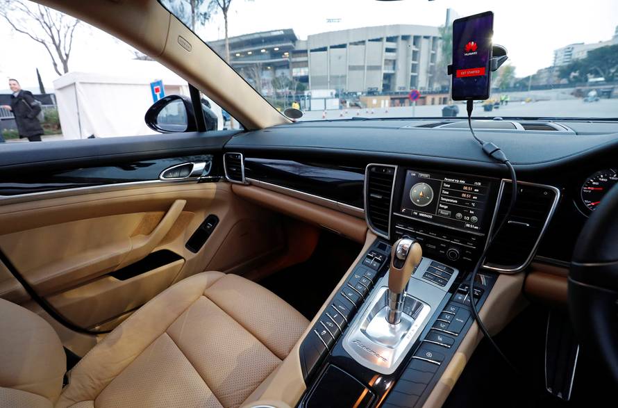 A Huawei Mate 10 Pro mobile is used to control a driverless car during the Mobile World Congress in Barcelona