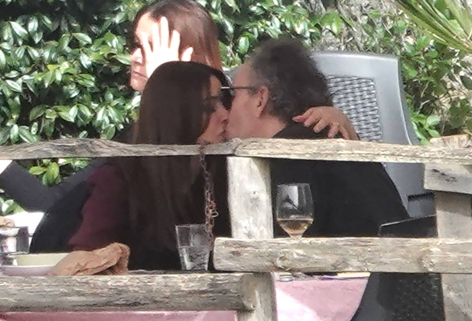 *EXCLUSIVE* WEB MUST CALL FOR PRICING  - Monica Bellucci and Tim Burton pack on the PDA as they enjoy a little fine Italian dining during their romantic trip to Calcata.*PICTURES TAKEN ON 30/03/2024*