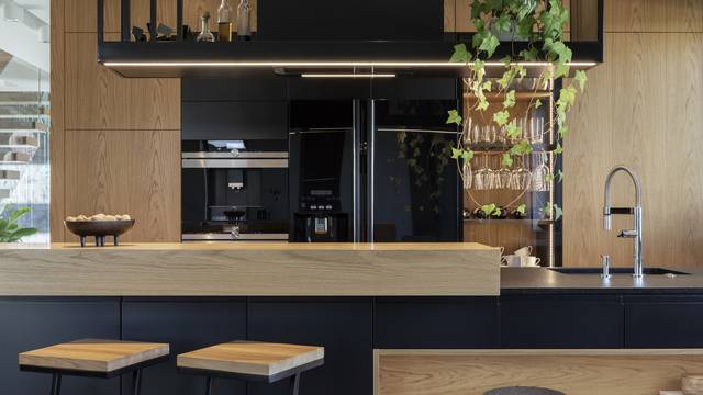 Minimalistic modern wooden panel kitchen interior with ergonomic biuld-in kitchen and kitchen island. Geometric forms and shapes. Details. Template. "n