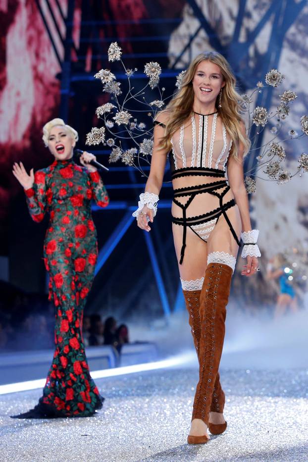 Musician Lady Gaga performs as a model presents a creation during the 2016 Victoria's Secret Fashion Show at the Grand Palais in Paris