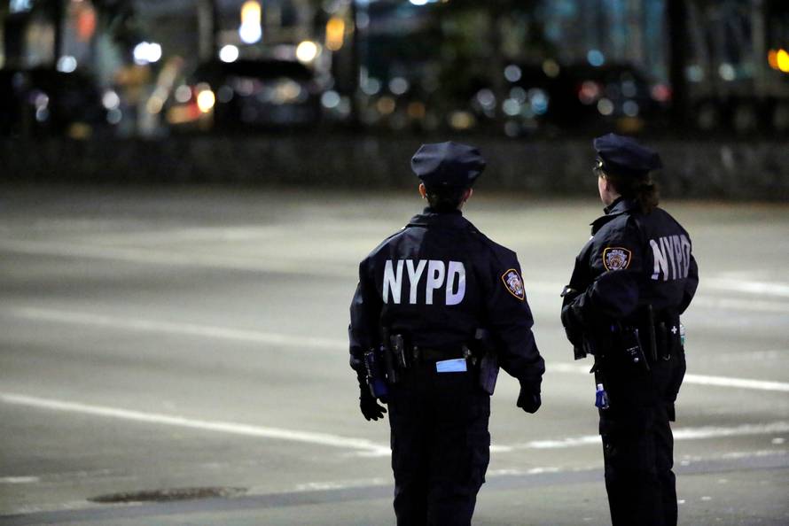 Police look towards the scene of a pickup truck attack on West Side Highway in Manhattan, New York