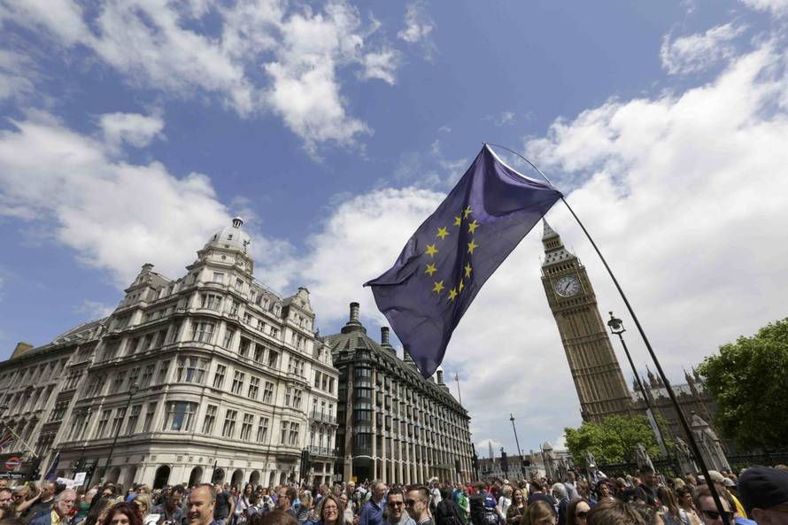 Protestors walk into Parliament Square during a 'March for Europe' demonstration against Britain's decision to leave the European Union, central London