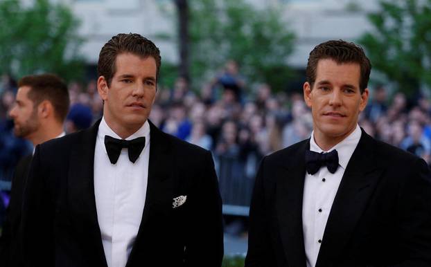 FILE PHOTO: Entrepeneurs Tyler and Cameron Winklevoss arrive at the Met Gala in New York