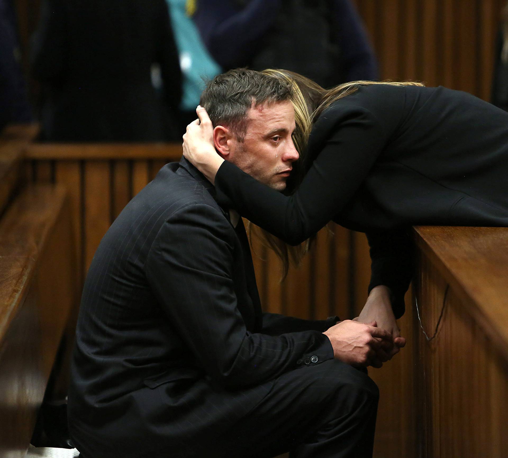 Oscar Pistorius is seen with sister Aimee after proceedings on the third day of his resentencing hearing for the 2013 murder of his girlfriend Reeva Steenkamp in the North Gauteng High Court in Pretoria