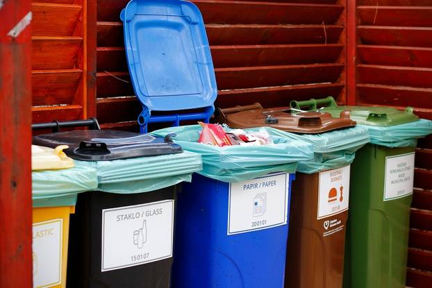 Five,Colorful,Recycle,Plastic,Bins,With,Description,In,Wooden,Shelter