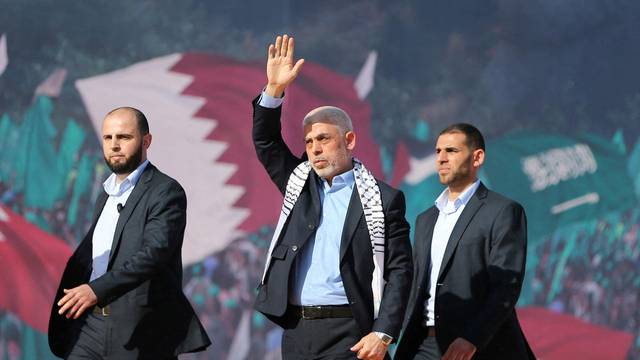 FILE PHOTO: Palestinians attend rally to mark 35th anniversary of Hamas founding, in Gaza City