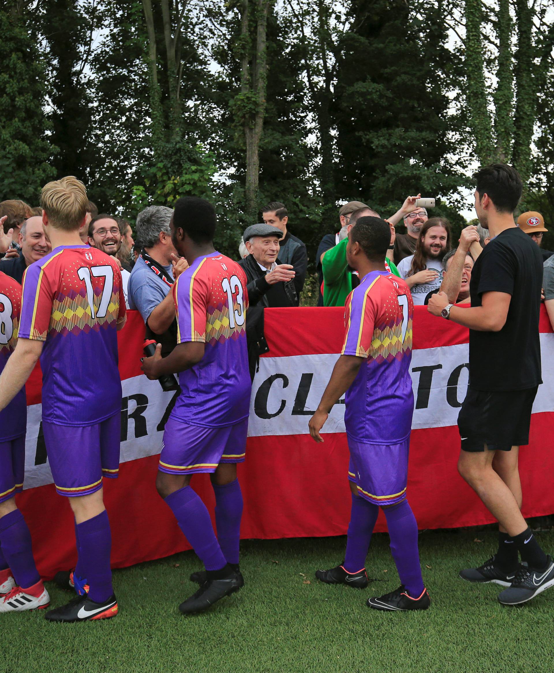 Clapton CFC players shake hands with their supporters after winning 2-0 away game against Healing Town in East Acton, in London