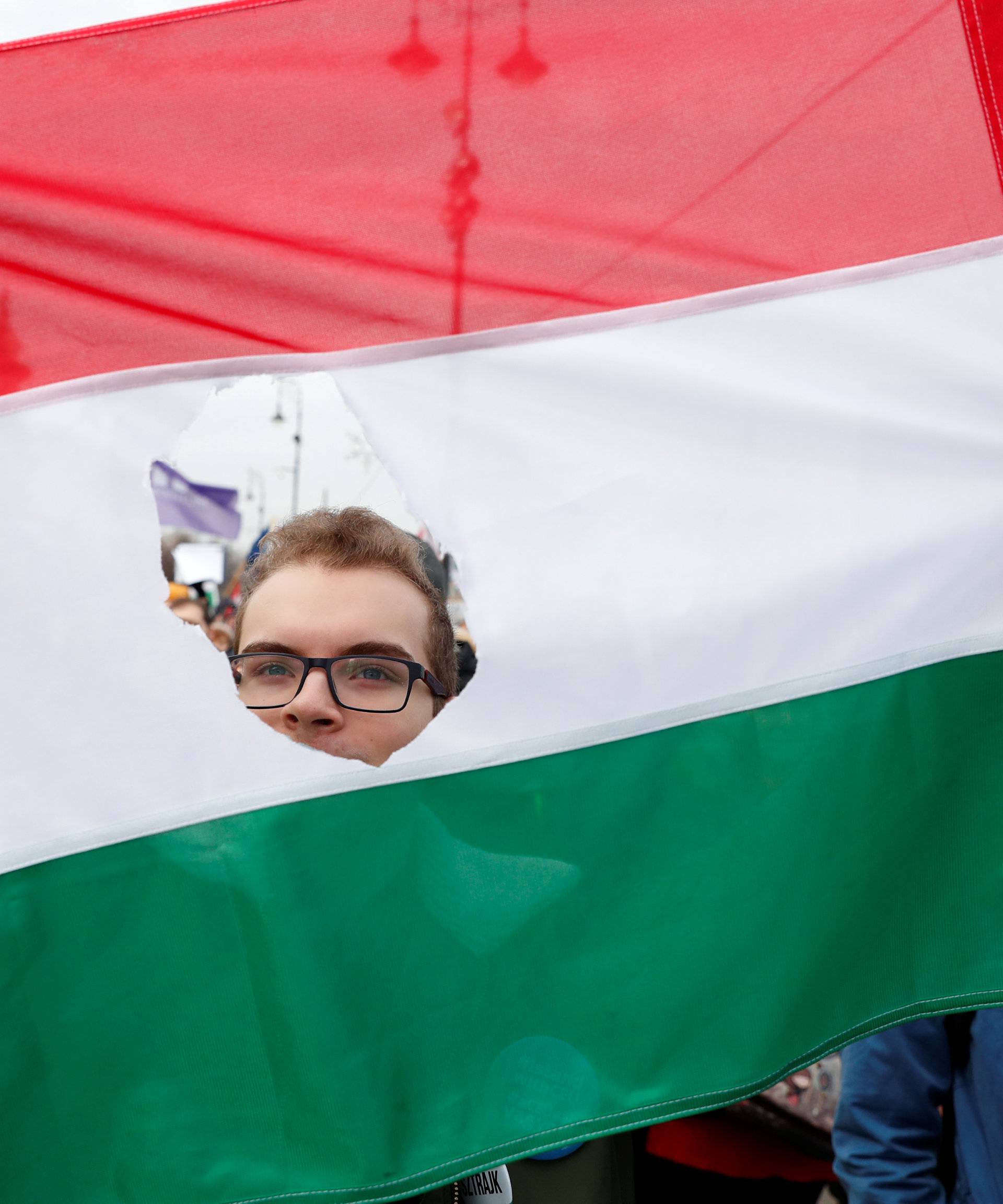 People take part in a protest against a proposed new labor law, billed as the "slave law", in Budapest