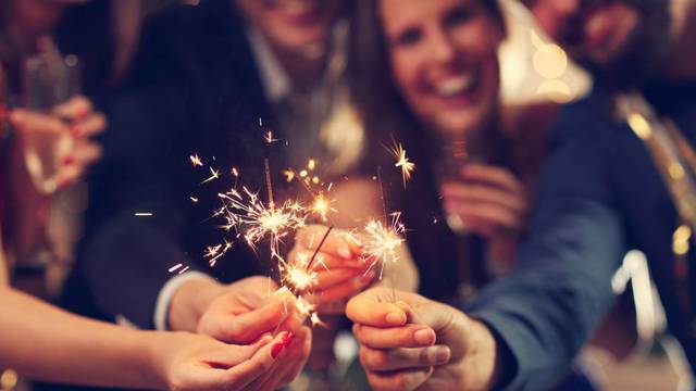Picture,Showing,Group,Of,Friends,Having,Fun,With,Sparklers
