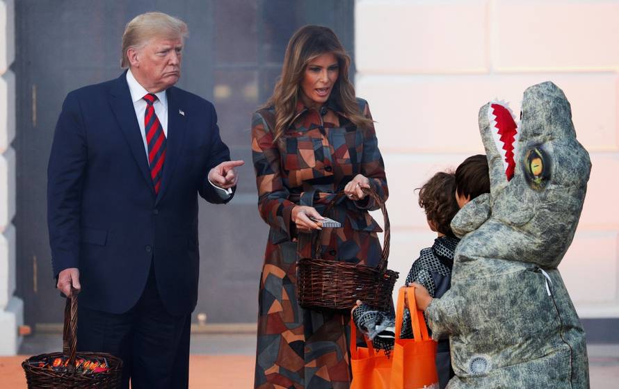U.S. President Trump and first lady hand out candy to schoolchildren in advance of Halloween in Washington
