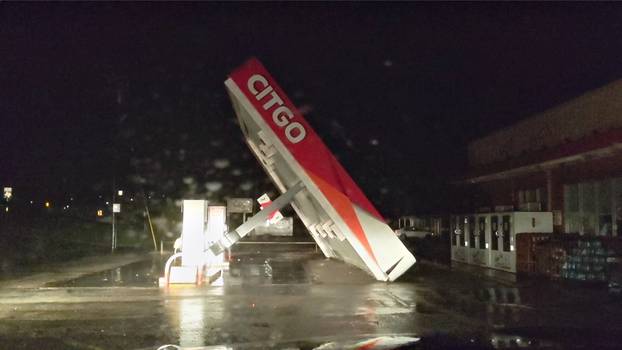 A CITGO gas station roof is blown away by Tropical Storm Nicholas in Matagorda, Texas