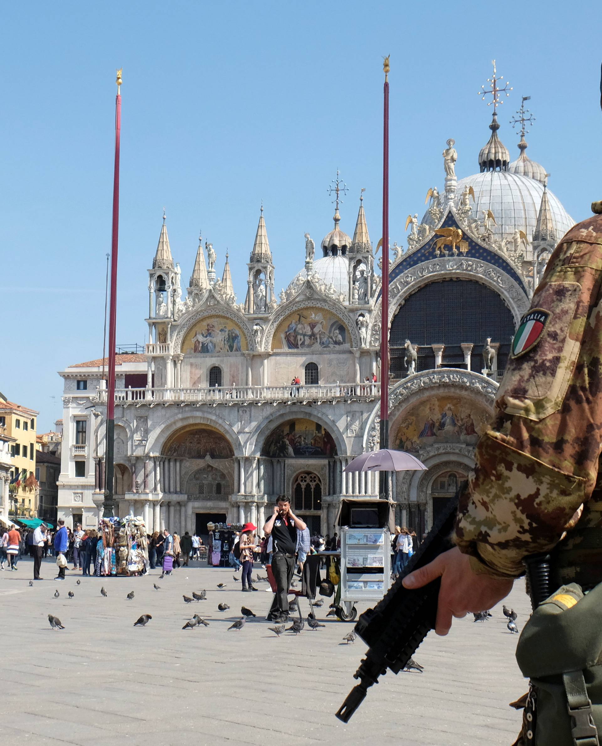 A soldier patrols Saint Mark's Square in Venice
