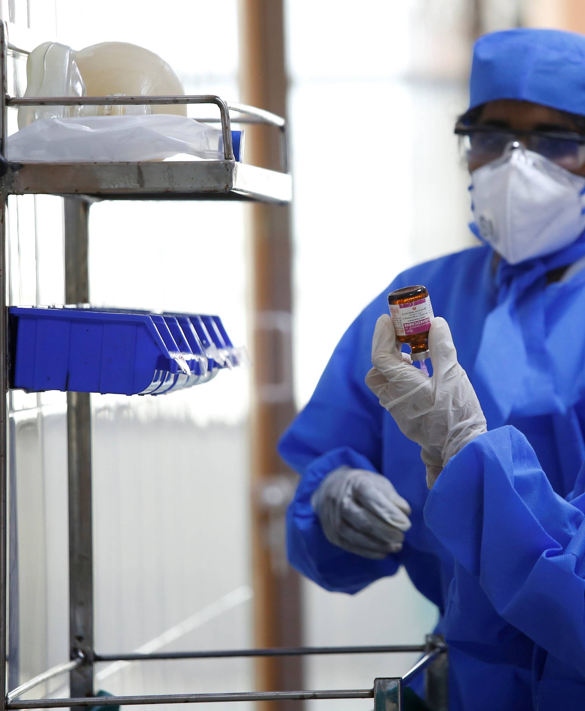 Medical staff with protective clothing are seen inside a ward specialised in receiving any person who may have been infected with coronavirus, at the Rajiv Ghandhi Government General hospital in Chennai