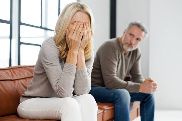 Upset,Middle-aged,Couple,Is,Arguing,At,Home,,Frustrated,Blonde,Woman