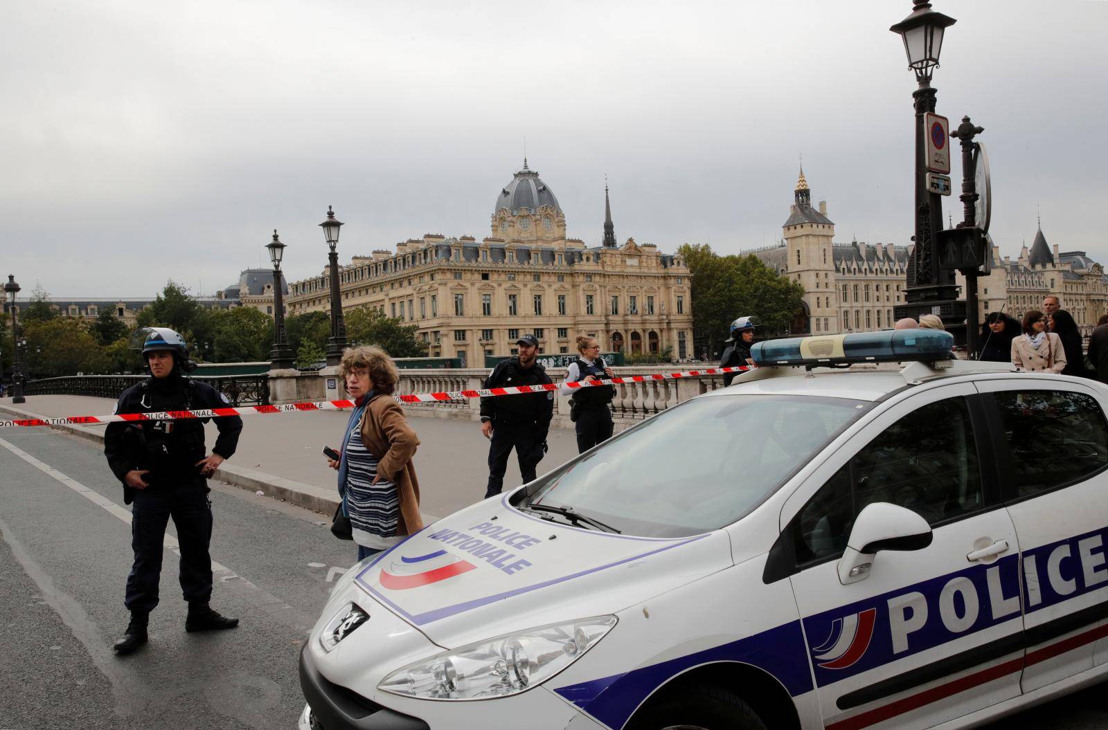 French police secure the area in front of the Paris Police headquarters in Paris