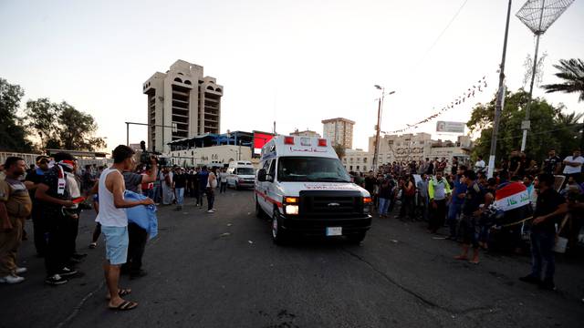 An ambulance is pictured transporting anti-government protesters injured during the storming of Baghdad