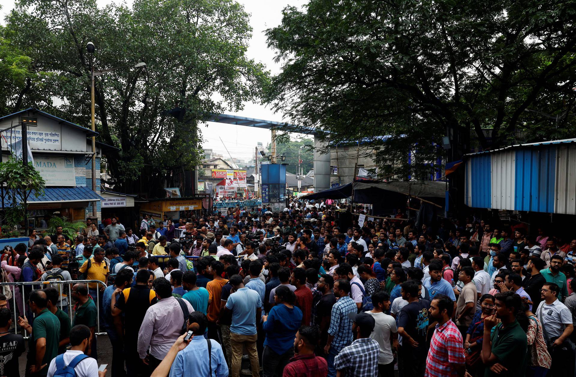 Doctors, paramedics and medical students gather as they attend a protest against what they say was rape and murder of a trainee doctor, inside the premises of R G Kar Medical College and Hospital in Kolkata